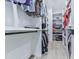 Organized walk-in closet with custom shelving and hanging rods for optimal storage at 106 Belmont Dr, Canton, GA 30115