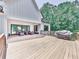 Expansive deck perfect for outdoor entertaining, featuring a grill and comfortable seating area at 106 Belmont Dr, Canton, GA 30115