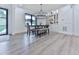 Stylish dining area with modern lighting, built-in cabinets, and a large window with backyard views at 106 Belmont Dr, Canton, GA 30115