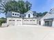 Exterior view of the attached garage with multiple bays and a long driveway at 106 Belmont Dr, Canton, GA 30115