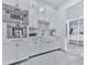 Modern kitchen with white cabinets, stainless steel appliances and adjacent walk-in closet at 106 Belmont Dr, Canton, GA 30115