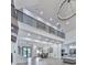 Bright open-concept with soaring ceilings, modern lighting, and integrated living, dining, and kitchen areas at 106 Belmont Dr, Canton, GA 30115