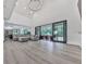 Expansive living space featuring open-concept design, modern lighting, and seamless access to outdoor living at 106 Belmont Dr, Canton, GA 30115
