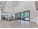 Spacious living room features high ceilings, hardwood floors, and large sliding glass doors to the backyard deck at 106 Belmont Dr, Canton, GA 30115