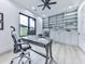 Bright home office featuring custom built-ins, a modern desk, and a large window with a view at 106 Belmont Dr, Canton, GA 30115
