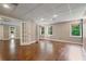 Spacious basement featuring wood-look floors, recessed lighting, and access to the outdoors at 1758 Rosehedge Nw Way, Kennesaw, GA 30152