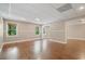 Finished basement with wood-look flooring, recessed lighting, and multiple windows for natural light at 1758 Rosehedge Nw Way, Kennesaw, GA 30152