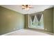 Bedroom with neutral carpet and green walls featuring double windows with curtains at 1758 Rosehedge Nw Way, Kennesaw, GA 30152
