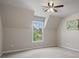 Bedroom with neutral walls, carpet, and a window offering views of the surrounding neighborhood at 1758 Rosehedge Nw Way, Kennesaw, GA 30152