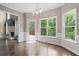 Breakfast nook features hardwood floors, exterior access to deck, and natural light from large windows at 1758 Rosehedge Nw Way, Kennesaw, GA 30152