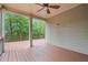 Lovely outdoor deck with ceiling fan and a treed view provides a calming space at 1758 Rosehedge Nw Way, Kennesaw, GA 30152