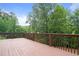 Wooden deck overlooking a lush green backyard offers private, peaceful outdoor space at 1758 Rosehedge Nw Way, Kennesaw, GA 30152