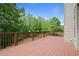 Spacious wooden deck ideal for entertaining or enjoying the nature view of the surrounding trees at 1758 Rosehedge Nw Way, Kennesaw, GA 30152