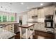 Modern kitchen features stainless steel appliances, granite countertops, and custom cabinets at 1758 Rosehedge Nw Way, Kennesaw, GA 30152