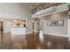 Bright open living room features hardwood floors, tall ceilings, and flows into an updated kitchen with an eat-in bar at 1758 Rosehedge Nw Way, Kennesaw, GA 30152