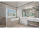 Relaxing main bathroom offers a soaking tub, glass enclosed shower and dual vanities at 1758 Rosehedge Nw Way, Kennesaw, GA 30152