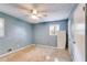 Light-blue bedroom featuring a ceiling fan, window, closet, and wall-mounted air conditioner at 230 King Arthur Dr, Woodstock, GA 30189