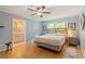 Main bedroom featuring hardwood floors, ceiling fan, and en suite bathroom at 2785 Fontainebleau Dr, Dunwoody, GA 30360