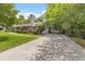 Charming single-story home featuring a landscaped front yard and driveway with basketball hoop at 2785 Fontainebleau Dr, Dunwoody, GA 30360