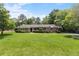 Charming single-story brick home featuring a lush green lawn and mature landscaping at 2785 Fontainebleau Dr, Dunwoody, GA 30360