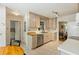 Kitchen with wood cabinets, stainless steel dishwasher, and breakfast nook overlooking the living area at 2785 Fontainebleau Dr, Dunwoody, GA 30360
