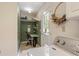 Mud room laundry combo with green wall and desk area at 2785 Fontainebleau Dr, Dunwoody, GA 30360