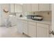 Spacious laundry room with white cabinets, countertop, and modern appliances at 2785 Fontainebleau Dr, Dunwoody, GA 30360