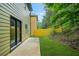 Backyard with manicured lawn and a wood fence at 6571 Splitpine Ct, Atlanta, GA 30349