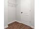 Walk-in closet featuring wood floor and a wire shelf at 6571 Splitpine Ct, Atlanta, GA 30349