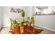 Dining room featuring a glass table with modern chairs, open to the kitchen at 6571 Splitpine Ct, Atlanta, GA 30349