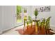 Bright dining area features stylish decor, a modern table and chairs, and natural light from the patio doors at 6571 Splitpine Ct, Atlanta, GA 30349