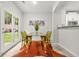 Bright dining area features stylish decor, a modern table and chairs with access to backyard at 6571 Splitpine Ct, Atlanta, GA 30349