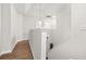Upstairs hallway features hardwood floors and classic white banister at 6571 Splitpine Ct, Atlanta, GA 30349