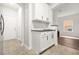 Kitchen area features white cabinets and granite countertops, with an open design at 6571 Splitpine Ct, Atlanta, GA 30349