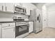 Well-equipped kitchen with stainless steel appliances and white cabinets at 6571 Splitpine Ct, Atlanta, GA 30349