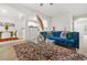 Modern living room with open access to the kitchen and a plush sofa at 6571 Splitpine Ct, Atlanta, GA 30349