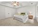 Large main bedroom with tray ceiling, a large bed, and lots of natural light at 6571 Splitpine Ct, Atlanta, GA 30349