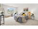 Spacious bedroom with large window, carpet and neutral walls at 6571 Splitpine Ct, Atlanta, GA 30349