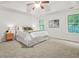 Spacious main bedroom with tray ceiling, carpet and lots of natural light at 6571 Splitpine Ct, Atlanta, GA 30349