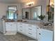 Modern bathroom with double vanity, granite countertops, and sleek black hardware at 970 Tarpley Nw Rd, Kennesaw, GA 30152