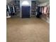 Large walk-in closet with custom shelving and ample storage space for shoes and clothes at 970 Tarpley Nw Rd, Kennesaw, GA 30152