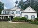 Charming two-story home with a well-manicured front yard and classic white facade at 970 Tarpley Nw Rd, Kennesaw, GA 30152