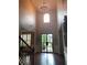 Soaring foyer with natural light, hardwood floors, chandelier and decorative wrought iron door at 970 Tarpley Nw Rd, Kennesaw, GA 30152