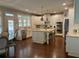 Bright kitchen featuring white cabinets, stone countertops, large island, and stainless appliances at 970 Tarpley Nw Rd, Kennesaw, GA 30152