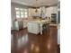 Bright kitchen featuring white cabinets, stone countertops, large island, and stainless appliances at 970 Tarpley Nw Rd, Kennesaw, GA 30152