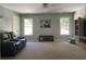 Spacious living room featuring modern decor and two large windows that flood the space with light at 970 Tarpley Nw Rd, Kennesaw, GA 30152