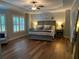 Spacious main bedroom suite with hardwood floors, tray ceiling, and lots of natural light at 970 Tarpley Nw Rd, Kennesaw, GA 30152