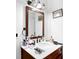 Bathroom with dark wood vanity, white marble countertop, and vanity mirror at 1150 Rankin St # 19O, Stone Mountain, GA 30083