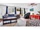 Bright living area flowing to patio, featuring stylish sofas, ceiling fan, and contemporary decor creating an inviting atmosphere at 1150 Rankin St # 19O, Stone Mountain, GA 30083