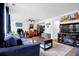 Open living area flowing into dining, featuring sleek furniture, ceiling fan, and contemporary décor creating an inviting atmosphere at 1150 Rankin St # 19O, Stone Mountain, GA 30083